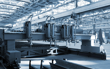 Large industrial machine operating in a factory setting, showcasing its complex design and functionality.