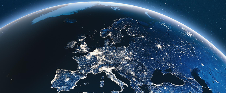 A satellite view of Europe at night, showcasing illuminated cities and landmarks across various European countries.