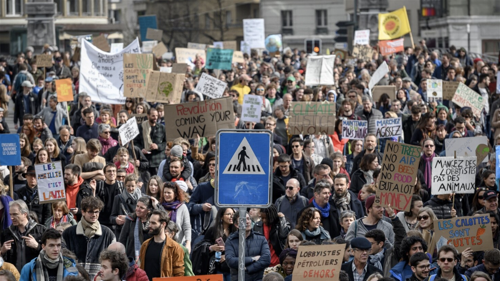 Tens of thousands demand climate action in Swiss capital